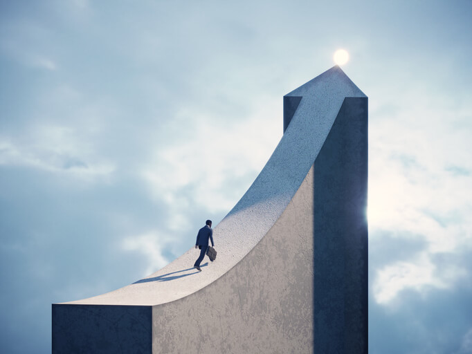 business growth concept - business man running on arrow shaped bridge to the light 