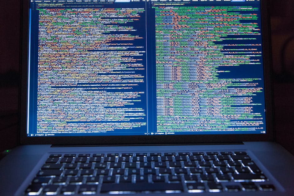laptop with code displayed on it - Learn how to sell custom software development services concept