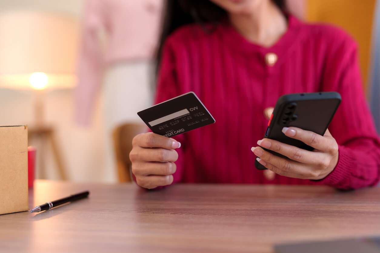 Discover why our eCommerce website design in Concord, NH, is the top choice for enhancing your brand, boosting visibility, and ensuring shopper satisfaction. Young business woman is using smartphone for online shopping and using credit card for payment