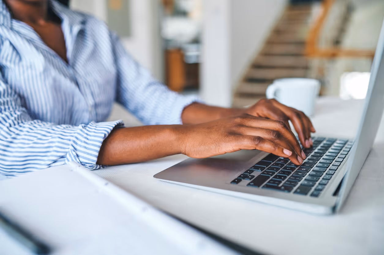 woman typing on keyboard branding and creative services - branding and creative services